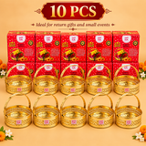 Promotional banner for the Ashtok Puja Basket 10 Pcs Pack, highlighted as "Ideal for return gifts and small events". Ten metallic gold puja baskets are displayed in two rows in front of ten matching red Ashtok printed gift boxes set on a warm backdrop decorated with marigold flowers and loose petals.