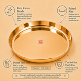 Product infographic for an Ashtok Pure Kansa dinner thali plate measuring 11.5 inches in diameter. The image displays a glossy, golden-bronze bell metal thali with a raised rim, accompanied by key feature callouts highlighting its pure kansa finish, raised rim, suitability for daily use, and traditional dining appeal.