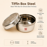 Ashtok 304 stainless steel round tiffin box featuring an laser-engraved tree design lid leaned against the container, highlighting its 4-inch diameter, 2.5-inch height, compact round shape, and secure closure.