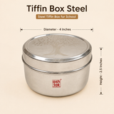 Front view of a closed Ashtok stainless steel tiffin box with tree pattern on the lid, annotated with dimensions showing 4 inches diameter and 2.5 inches height.