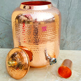 Ayurvedic copper water storage tank with tap, designed for healthy hydration and easy water dispensing.