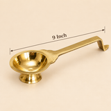 Brass Aarti Diya lit for pooja and daily rituals, placed in a festive prayer setting.Dimensions 9 inches 