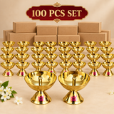 Bulk presentation of 100 traditional brass diyas with multiple polished golden oil lamps arranged in front of plain packaging boxes, suitable for wholesale orders, festive distribution, religious events, temple functions and large quantity gifting.