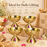 Gifting infographic titled 'Ideal for Bulk Gifting - TRADITION | GRATITUDE | LASTING IMPRESSIONS' by Ashtok. Four polished brass stand diyas are arranged around a luxury beige gift box with a ribbon and a card reading 'A Gift of Tradition'.
