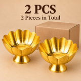 Set of 2 traditional brass lotus flower bowls featuring a polished golden finish, elegantly shaped floral petals, textured inner bases and sturdy circular pedestal stands. Both decorative brass bowls are displayed alongside a simple brown cardboard packaging box on a neutral beige background. Each bowl measures 5 inches in diameter and 2.5 inches in height, suitable for home decoration, festive gifting, pooja arrangements and traditional return gifts.