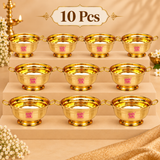 Set of 10 matching Brass Gangal and Flower Pot decorative puja bowls arranged neatly on a beige tiered display, each featuring dual side handles, polished brass finish and raised pedestal base, suitable for wedding gifting, festive functions, return gifts and small bulk orders.