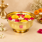 Brass Gangal decorative bowl styled with floating flowers, rose petals and a diya in a traditional festive setting, showing its use for puja, floral arrangements, home decoration and special occasions.