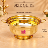 Size guide image of a Brass Gangal and Flower Pot decorative puja bowl showing approximately 7 inches diameter and 3 inches height, with the wide circular bowl, dual handles, polished brass finish and raised base clearly visible on a warm beige background for easy size reference.