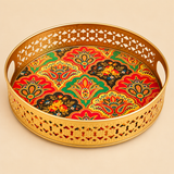 Decorative brass tray with cutwork sides and multicolour paisley floral base, shown individually on a beige background.