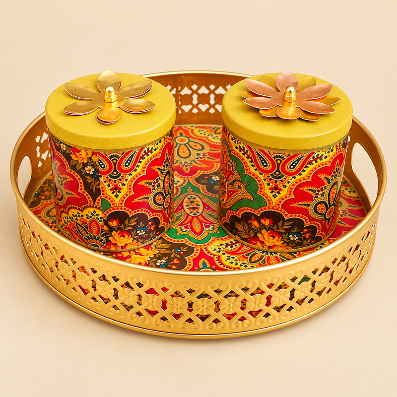 Front view of brass gift tray set with two matching lidded bowls, featuring colourful paisley print and floral lid accents on a beige background