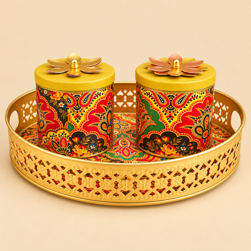 Brass gift tray with two lidded bowls featuring colourful paisley floral design, arranged on a round decorative tray with handles against a beige background.