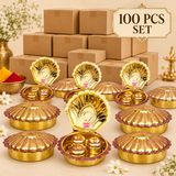 Bulk presentation of 100 Brass Haldi Kumkum Boxes shown with multiple decorative shell-shaped containers arranged in front of plain packaging boxes, suitable for wholesale orders, wedding return gifts, festive distribution and large quantity gifting requirements.