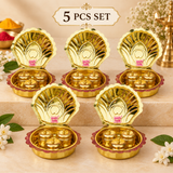 Set of 5 Brass Haldi Kumkum Boxes arranged in an elegant beige gifting display, each featuring a decorative shell-shaped brass case with three individual containers for haldi, kumkum and sindoor, ideal for festive gifting and family functions.