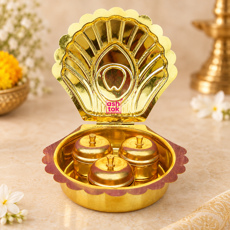 Brass Haldi Kumkum Box featuring a decorative shell-shaped hinged outer case with three individual covered containers inside, polished golden brass finish and scalloped detailing, professionally presented on a premium beige studio background for puja, festive rituals and traditional gifting.