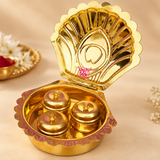 Detailed close-up of Brass Haldi Kumkum Box showing the embossed shell-shaped hinged lid, scalloped border, polished golden brass surface, three individual covered containers and fine decorative craftsmanship of this traditional sindoor and kumkum storage box.