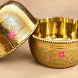 Close-up view of handcrafted brass bowl highlighting the detailed floral engraving, polished golden interior, decorative beaded rim and smooth handcrafted finish, showing the fine craftsmanship and traditional styling of the 200ml brass serving bowl.