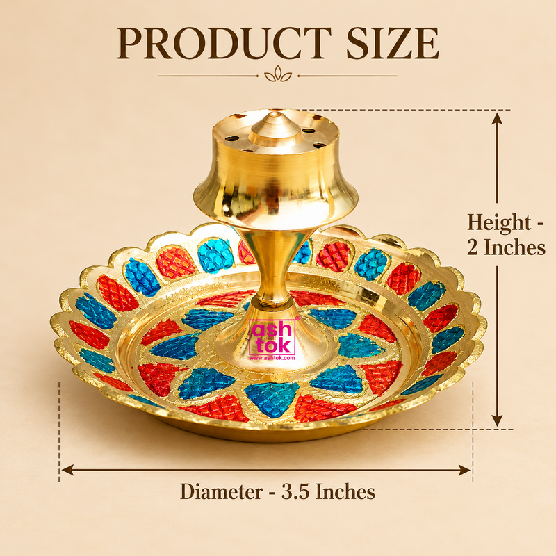 Brass Incense Stick Holder size guide showing a decorative round brass agarbatti stand measuring 3.5 inches in diameter and 2 inches in height. Features a polished golden brass central holder with multiple holes for placing incense sticks, a raised pedestal and a circular decorative base with intricate red and blue enamel-style floral patterns. The dimensional illustration highlights its compact tabletop design, suitable for pooja rooms, home temples, daily incense rituals and traditional festive decoration