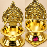 Close-up collage image highlighting the details of the Brass Kamakshi Deepam. The composition includes enlarged views of the carved Kamakshi-style backplate, the smooth and reflective oil bowl, and the polished stepped base of the lamp. The close-up presentation showcases the premium brass finish, intricate traditional craftsmanship, and elegant structure of the deepam, helping customers appreciate the quality and design in greater detail.