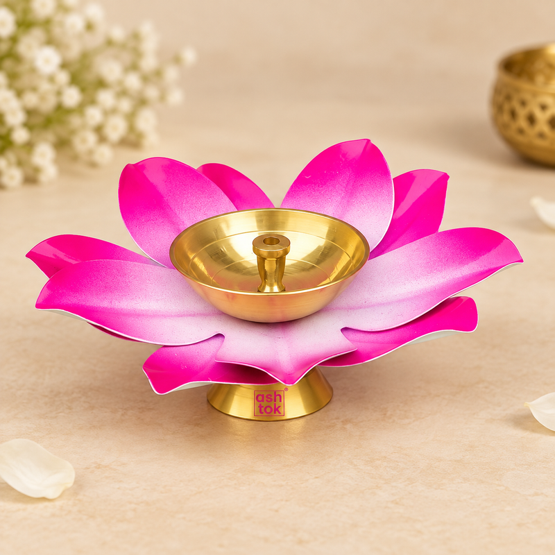 Decorative Brass Kamal Diya in bright pink lotus design with layered petals fading from vivid magenta at the outer edges to pale pink and white toward the center, featuring a polished brass oil bowl, central wick holder and matching brass pedestal base, photographed as a clean main product image on a premium beige studio background with warm lighting and soft shadows, suitable for daily puja, Akhand diya use, festive worship, Diwali decor, home mandir styling, wedding rituals and traditional gifting.