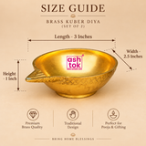 Brass Kuber Diya product size guide showing the exact dimensions of one traditional brass pooja oil lamp, measuring 3 inches in length, 2.5 inches in width, and 1 inch in height. The golden brass diya features a broad rounded bowl-shaped oil reservoir, smooth reflective interior, decorative pointed wick spout, finely engraved geometric patterns along the outer rim, and a sturdy low circular base.