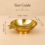 Brass Kuber Diya product size guide displaying the exact dimensions of one traditional brass pooja oil lamp, measuring 3 inches in length, 2.5 inches in width, and 1 inch in height. The golden brass diya features a smooth rounded oil reservoir, polished reflective interior, decorative pointed wick spout, intricate floral and leaf engravings around the exterior surface, and a compact circular pedestal base. The measurement illustration helps customers understand the size and proportions of this traditional b