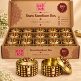 Packaging image of Brass KumKum Box 100 pcs set in a branded compartment box with multiple units neatly arranged and sample pieces displayed in front.