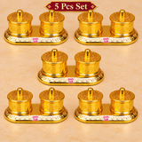 Set of 5 Brass Kumkum Boxes arranged in a clean premium beige display, each featuring double round sindoor compartments with embossed lids and a polished golden finish, suitable for return gifts, festive gifting and family functions.