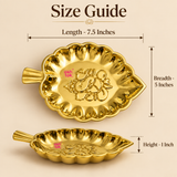 Size guide for brass leaf tray showing approximately 7.5 inches length, 5 inches breadth and 1 inch height, with top and side views clearly displaying the leaf shape, raised edge and embossed Ganesh design.