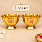 Set of 2 Brass Lotus Chandan Cups displayed together on a premium beige background, featuring matching lotus-shaped rims, polished golden finish and pedestal bases for puja use and gifting.
