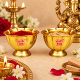 Brass Lotus Chandan Cups shown in a traditional puja setting with kumkum and chandan paste inside the bowls, surrounded by diya, flowers and devotional decor for daily worship and festive rituals.