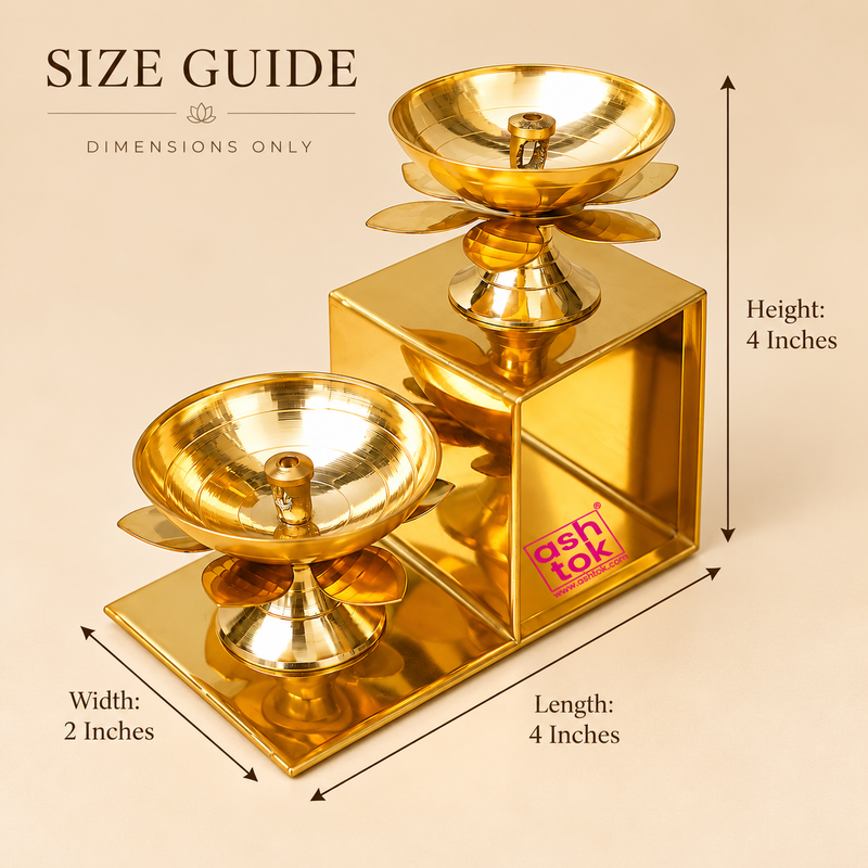 Brass Lotus Diya with Stand size guide showing a two-step golden brass oil lamp arrangement with clearly marked measurements of 4 inches length, 2 inches width and 4 inches height. The decorative stepped structure holds two traditional lotus-shaped diya bowls at different elevations, each featuring a central wick holder, smooth polished interior, petal-shaped decorative support and sturdy pedestal. The dimensional illustration highlights the compact rectangular frame and elegant tiered arrangement, suitable