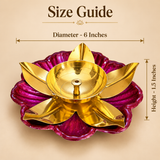 Size guide of a traditional brass lotus diya featuring a golden brass oil bowl with a central wick holder, curved golden lotus petals and a decorative pink floral base. The diya measures 6 inches in diameter and 1.5 inches in height, making it suitable for home mandir decoration, daily puja and Diwali lighting arrangements.