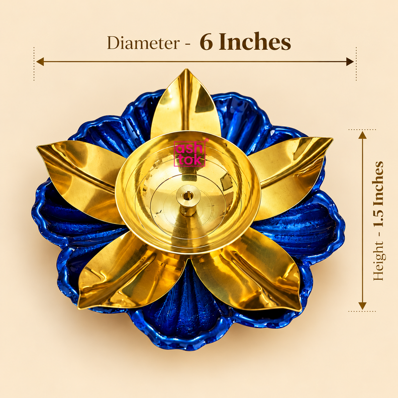 Size guide of a decorative brass lotus diya featuring a golden brass oil bowl with a central wick holder, polished golden flower petals and a royal blue lotus-shaped base with textured detailing. The product measures 6 inches in diameter and 1.5 inches in height, making it suitable for traditional puja rituals, Diwali lighting arrangements, home temple decoration and festive displays.