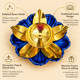 Product features infographic highlighting a traditional brass lotus diya with a polished golden brass finish, royal blue decorative flower-shaped base, elegant lotus petal design and a central oil bowl with wick holder. The image showcases its traditional floral appearance and suitability for daily puja, Diwali celebrations, decorative home mandir arrangements, religious ceremonies and festive gifting.