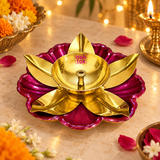 Decorative brass lotus diya displayed in a festive Diwali and puja setting with warm lighting, flowers and traditional decorative elements, showing the golden brass oil lamp bowl, central wick holder, gold lotus petals and deep magenta flower base as an attractive diya for home mandir decoration, festive lighting, Diwali celebrations, puja ceremonies and special occasions.
