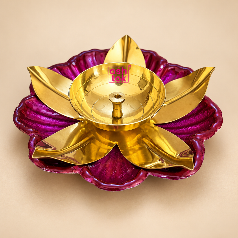 Traditional brass lotus diya set of 100 pieces featuring a polished golden brass finish with decorative pink lotus-shaped bases, neatly arranged in a compartmentalized cardboard box with protective wrapping. Ideal for Diwali celebrations, temple puja, festive decorations, wedding return gifts and bulk gifting.