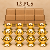 Brass Lotus Diya Pack of 12 Pcs showcasing twelve beautifully crafted traditional golden brass oil lamps arranged neatly in three rows of four with ordinary brown cardboard packaging boxes on a premium beige studio background.