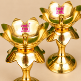Close-up view of two traditional Brass Lotus Diya Stands showcasing the intricate lotus flower petals, smooth polished golden brass finish, central cylindrical oil wick holders and decorative layered floral design. The detailed view highlights the reflective brass surface, curved lotus petals, elegant supporting stem and circular pedestal base. Each diya stand measures 2.5 inches in diameter and 5.5 inches in height, making it suitable for traditional pooja rituals, decorative oil lamp arrangements, Diwali 