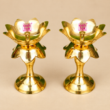 Pair of traditional Brass Lotus Diya Stands featuring a beautiful lotus flower design, polished golden brass surface, decorative layered petals, central oil wick holders and sturdy round pedestal bases. Each diya stand measures 2.5 inches in diameter and 5.5 inches in height. Suitable for daily pooja, home mandir decoration, Diwali celebrations, festive lighting, religious ceremonies and traditional home decor.