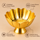 Product features infographic highlighting a decorative brass flower bowl with a polished golden brass finish, elegant lotus flower-shaped petals, smooth scalloped edges and a raised pedestal base. The bowl features an attractive circular textured inner design and traditional floral appearance, making it suitable for flower arrangements, festive decoration, dry fruit presentation, home décor and gifting during special occasions.