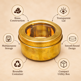 Product features infographic showcasing a traditional round brass masala box with a golden brass finish, transparent viewing lid, smooth cylindrical body and multipurpose storage design. The image highlights its brass construction, removable transparent lid, reusable container design and suitability for organizing Indian spices, dry fruits, kitchen ingredients and everyday household essentials.