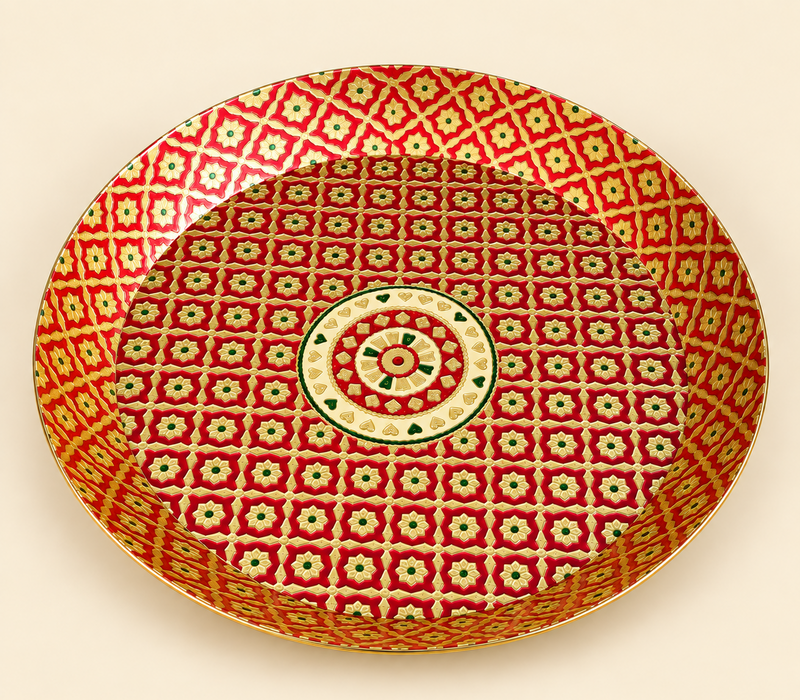 Product feature infographic of a round red and gold Meenakari brass tray. Four circular callouts highlight key features: 'Decorative Brass Finish' with an elegant look, 'Round Serving Tray' showcasing classic shape, 'Raised Rim' for keeping items secure, and 'Ideal for Serving & Decor' for festive occasions.