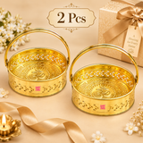 Set of 2 Brass Oval Shape Phool Butti Temple Baskets and Puja Buttis displayed together in a premium beige gifting presentation. Each basket features a polished golden brass finish, oval shape, decorative cutwork, embossed Om detailing, sturdy carrying handle and visible ASHTOK branding, suitable for festive gifting, housewarming gifts, wedding gifts, return gifts, temple use and religious occasions.