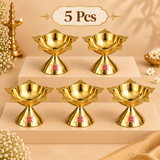 Set of 5 matching brass Panch Batti Diyas arranged neatly on a warm beige tiered display for gifting and small bulk orders. Each diya features the same polished golden brass finish, lotus-inspired bowl, five wick points and stable flared pedestal base. The five-piece quantity is suitable for wedding return gifts, festive gifting, housewarming ceremonies, religious functions, temple events, family celebrations and small event distribution. Each lamp can be used individually for oil or ghee during daily pooja
