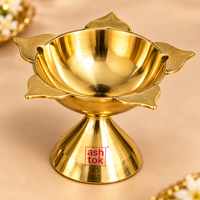 etailed close-up view of a polished brass Panch Batti Diya focusing on the upper lotus-shaped bowl, deep oil reservoir and five petal-style wick points arranged around the edge. The close framing highlights the smooth reflective brass interior, softly textured outer wick petals, rounded bowl construction and connection to the flared pedestal base. This detail image helps customers inspect the craftsmanship, brass finish, depth and five-wick configuration before purchase.