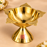 etailed close-up view of a polished brass Panch Batti Diya focusing on the upper lotus-shaped bowl, deep oil reservoir and five petal-style wick points arranged around the edge. The close framing highlights the smooth reflective brass interior, softly textured outer wick petals, rounded bowl construction and connection to the flared pedestal base. This detail image helps customers inspect the craftsmanship, brass finish, depth and five-wick configuration before purchase.