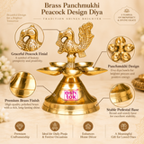 Professional product features image showcasing the traditional Brass Panchmukhi Peacock Design Diya with its detailed peacock finial, five beautifully arranged oil lamp bowls, polished golden brass surface, and decorative pedestal base. The central peacock figure features intricate ornamental feather patterns, a gracefully shaped head and neck, carved wing detailing, and an elaborately textured raised tail that creates an attractive traditional appearance. Five shallow brass diya bowls are positioned around