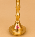 Close-up view of the handcrafted brass peacock diya base with a traditional turned stem and wide circular base, ideal for pooja, temple rituals, Diwali decoration, weddings, and festive home décor.