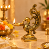 Brass Peacock Diya styled in a festive setup, showing its traditional decorative appeal for and gifting use.