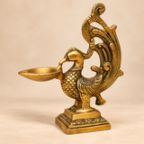 Brass Peacock Diya with traditional antique design shown in a main front product view on a clean background.